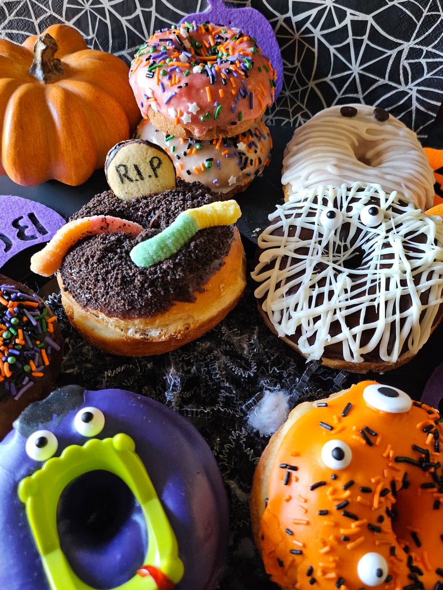 Overhead shot of decorated Halloween donuts at YLS Bakery & Cafe