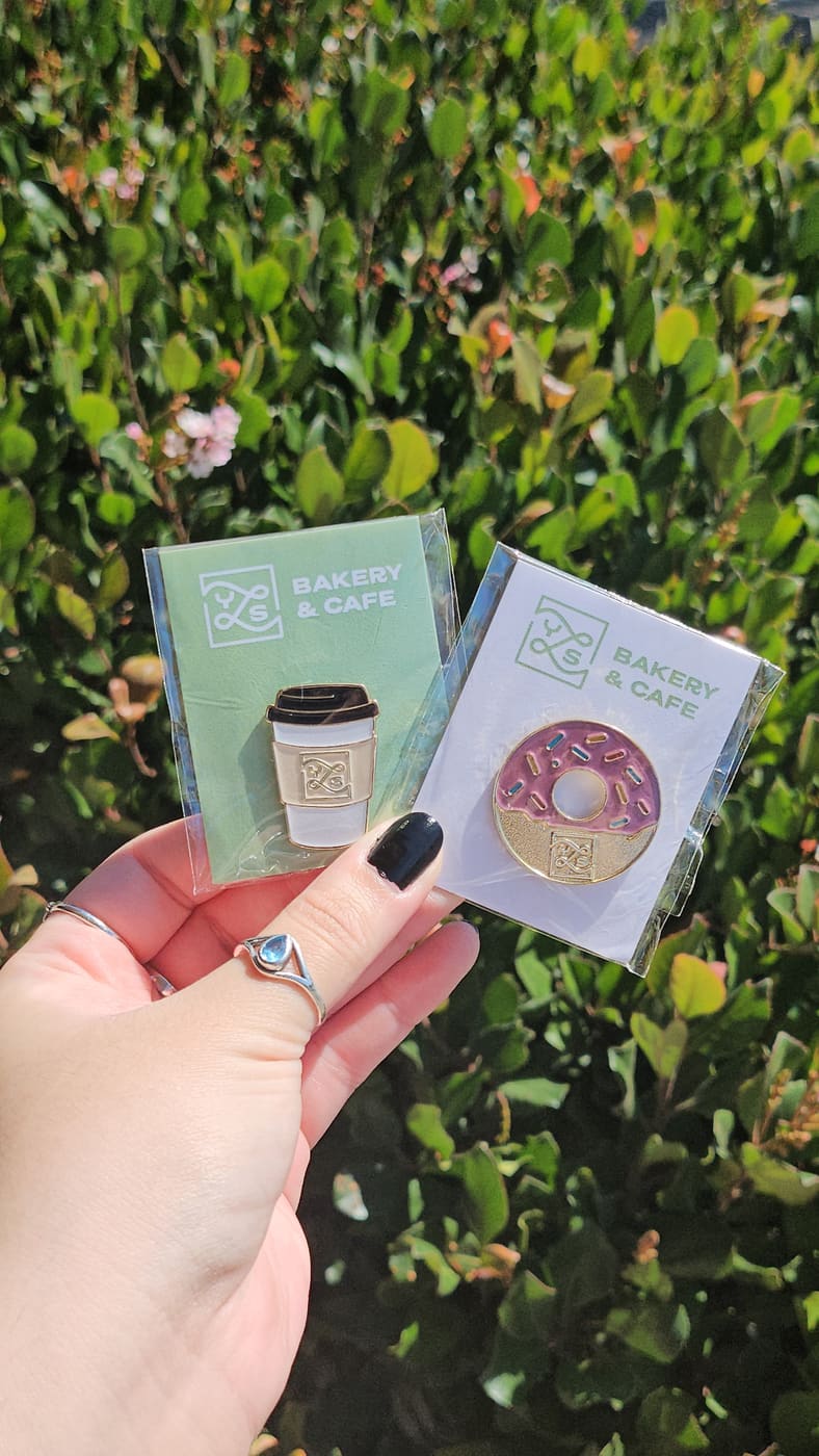 YLS Bakery & Cafe branded enamel pins